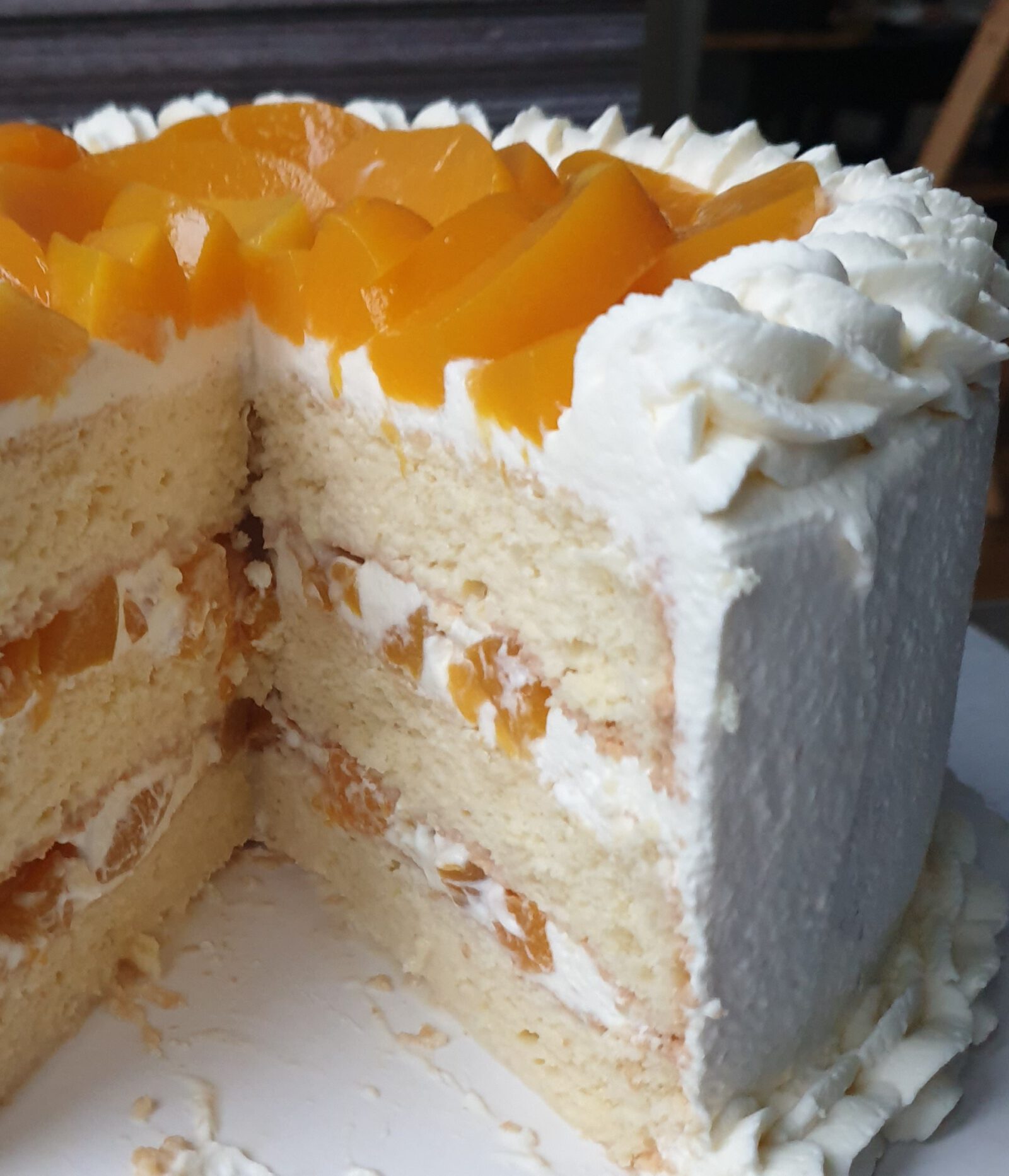 Tres leches layer cake filled with peaches and whipped cream – Love for 